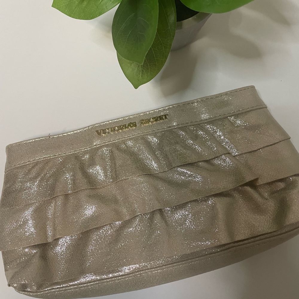 Victoria’sSecret Gold makeup bag